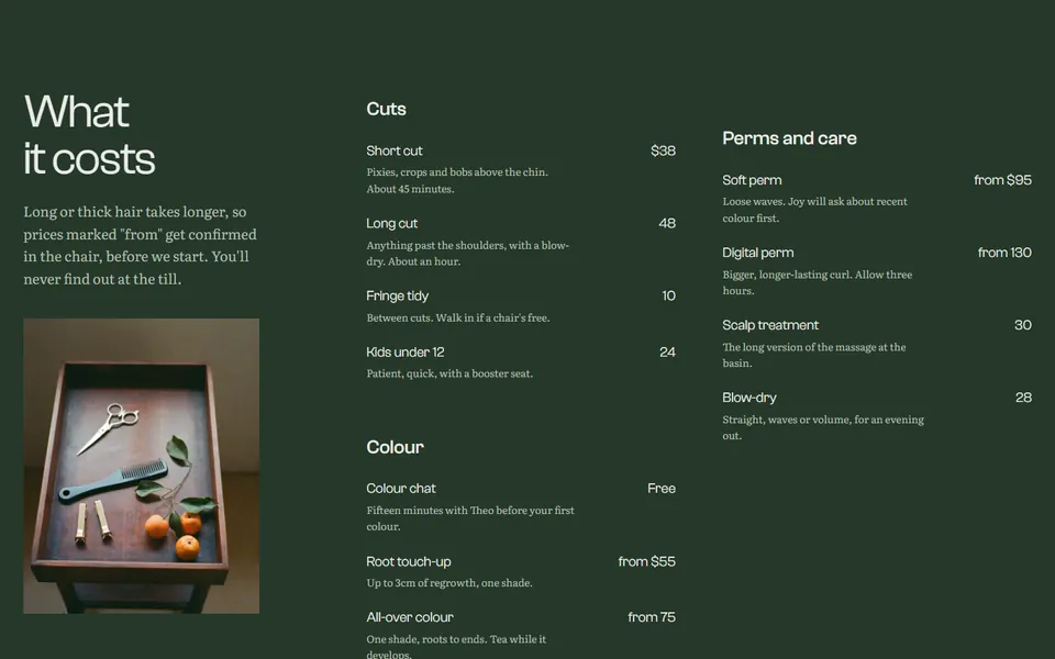 The price list on a dark green field, grouped into cuts, colour, and perms and care